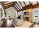 Comfortable living room featuring a brick fireplace, large windows, and modern furnishings at 980 Faith Se Ave, Atlanta, GA 30316