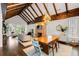 A combination of the dining, living, and kitchen areas features a fireplace, exposed beams, and hardwood floors at 980 Faith Se Ave, Atlanta, GA 30316