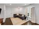 Cozy living room with a gray sofa, area rug, and bright window for ample natural light at 980 Faith Se Ave, Atlanta, GA 30316