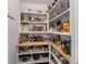 Spacious walk-in pantry with ample shelving and organized storage for food and kitchen essentials at 980 Faith Se Ave, Atlanta, GA 30316