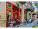 Patio dining at Weaver restaurant with bright red trim and open air seating on a sunny day at 980 Faith Se Ave, Atlanta, GA 30316