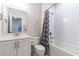 Bright bathroom featuring a shower-tub combination and modern fixtures at 1964 Attell Way, Decatur, GA 30033