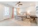 Bright bedroom with a ceiling fan and large bed near door to balcony at 1964 Attell Way, Decatur, GA 30033
