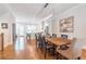 Beautiful dining room features a wooden table, modern light fixture, and hardwood floors at 1964 Attell Way, Decatur, GA 30033
