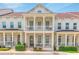 Attractive townhome exterior with white brick, multiple balconies, and well-maintained landscaping at 1964 Attell Way, Decatur, GA 30033