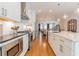 Modern kitchen with stainless steel appliances and open view to the dining and living areas at 1964 Attell Way, Decatur, GA 30033
