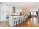 Bright, modern kitchen features a large island with seating and stainless steel appliances at 1964 Attell Way, Decatur, GA 30033