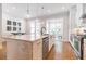 Bright kitchen with stainless steel appliances, a large island, and modern pendant lighting at 1964 Attell Way, Decatur, GA 30033