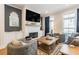 Cozy living room featuring a brick fireplace, large TV, and comfortable seating at 1964 Attell Way, Decatur, GA 30033