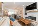 Open living room featuring a brick fireplace, television, and seamless access to the kitchen at 1964 Attell Way, Decatur, GA 30033