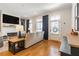 Comfortable living room with fireplace, TV, and stylish decor, leading to the front door at 1964 Attell Way, Decatur, GA 30033