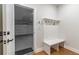 Convenient mudroom with a bench and hooks for coats and bags at 1964 Attell Way, Decatur, GA 30033