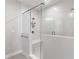 Modern bathroom featuring white subway tile and a glass-enclosed shower with a built-in bench at 1964 Attell Way, Decatur, GA 30033