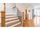 Beautiful staircase featuring hardwood steps and elegant wood railing at 1964 Attell Way, Decatur, GA 30033