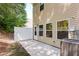 A private backyard area provides an outdoor space for relaxation and entertainment with the exterior of the home at 5525 Sable Way, Atlanta, GA 30349