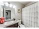 Bathroom with a large vanity with granite top and bathtub with shower at 5525 Sable Way, Atlanta, GA 30349