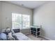 Bedroom showcasing a daybed with comfortable pillows and a window at 5525 Sable Way, Atlanta, GA 30349