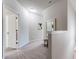 Upstairs hallway with neutral carpet, a decorative mirror and plenty of natural light at 5525 Sable Way, Atlanta, GA 30349