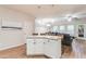 Bright kitchen island with seating overlooks the comfortable living area, creating an inviting open floor plan at 5525 Sable Way, Atlanta, GA 30349