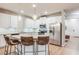 Modern kitchen with stainless steel appliances, granite countertops, an island with seating, and plenty of cabinet space at 5525 Sable Way, Atlanta, GA 30349