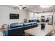 Open-concept living room and kitchen featuring modern appliances and a comfortable seating area at 5525 Sable Way, Atlanta, GA 30349