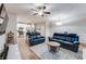 Bright living room with ample seating, hardwood floors, and a stylish coffee table at 5525 Sable Way, Atlanta, GA 30349