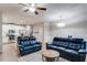 Open-concept living room showcasing hardwood floors, stylish furniture, and an inviting atmosphere at 5525 Sable Way, Atlanta, GA 30349