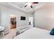 Bright main bedroom featuring a ceiling fan, TV, and large walk-in closet for ample storage at 5525 Sable Way, Atlanta, GA 30349