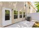 A private patio area provides an outdoor space for relaxation and entertainment with the exterior of the home at 5525 Sable Way, Atlanta, GA 30349