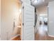 Stylish powder room featuring a pedestal sink, a round mirror, and modern fixtures, conveniently located near the entrance at 5525 Sable Way, Atlanta, GA 30349