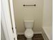 Bathroom featuring toilet with wood flooring, next to the tub at 5561 Petite Pt, Lithonia, GA 30058