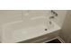 Close-up of a clean, white bathtub with chrome fixtures at 5561 Petite Pt, Lithonia, GA 30058