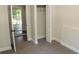 A bedroom features carpet, and bi-fold closet doors at 5561 Petite Pt, Lithonia, GA 30058