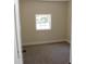 Bedroom featuring neutral carpet and a window at 5561 Petite Pt, Lithonia, GA 30058