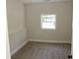 Cozy bedroom with neutral carpet and natural light from the window at 5561 Petite Pt, Lithonia, GA 30058