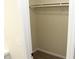 A simple walk-in closet with a rod and shelf, providing ample storage space at 5561 Petite Pt, Lithonia, GA 30058