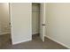 This bedroom has a walk-in closet with ample storage space and modern hardware at 5561 Petite Pt, Lithonia, GA 30058