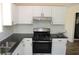 Bright kitchen featuring white cabinets and stainless steel appliances at 5561 Petite Pt, Lithonia, GA 30058