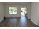 Open-concept living area with modern wood floors and plenty of natural light at 5561 Petite Pt, Lithonia, GA 30058