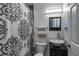 Bathroom featuring sleek vessel sink, modern fixtures, and patterned shower curtain at 6980 Roswell Rd # B13, Sandy Springs, GA 30328