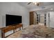 Bedroom featuring ceiling fan and en suite bathroom with stylish tile at 6980 Roswell Rd # B13, Sandy Springs, GA 30328