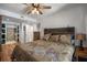 Bedroom featuring ceiling fan and en suite bathroom with stylish tile at 6980 Roswell Rd # B13, Sandy Springs, GA 30328