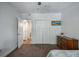 Bedroom with an en suite bath featuring a double closet and dresser at 6980 Roswell Rd # B13, Sandy Springs, GA 30328