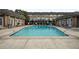 Inviting community pool surrounded by comfortable lounge chairs, perfect for relaxation and socializing at 6980 Roswell Rd # B13, Sandy Springs, GA 30328