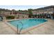 Sparkling community pool with ample seating and landscaped surroundings, offering a resort-like atmosphere at 6980 Roswell Rd # B13, Sandy Springs, GA 30328