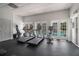 Bright fitness center with cardio machines and large windows overlooking a pool, promoting an active lifestyle at 6980 Roswell Rd # B13, Sandy Springs, GA 30328