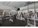 Fully equipped fitness center with a variety of machines, free weights, and mirrored walls for effective workouts at 6980 Roswell Rd # B13, Sandy Springs, GA 30328