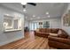 Open concept living area with a kitchen view, a large sofa and great lighting at 6980 Roswell Rd # B13, Sandy Springs, GA 30328