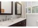 Elegant bathroom features a double sink vanity with marble countertop and framed mirrors, offering a luxurious feel at 205 3Rd Street Northeast Ne St # 4, Atlanta, GA 30308