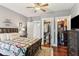 Comfortable bedroom featuring hardwood floors, quilt bedding, closet, and dresser at 205 3Rd Street Northeast Ne St # 4, Atlanta, GA 30308